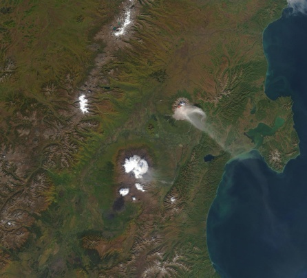 Shiveluch again, but this time imaged by the MODIS sensor on 17 September 2002. As well as the imagery, there is a red dot at the volcano indicating a thermal anomaly. (NASA)